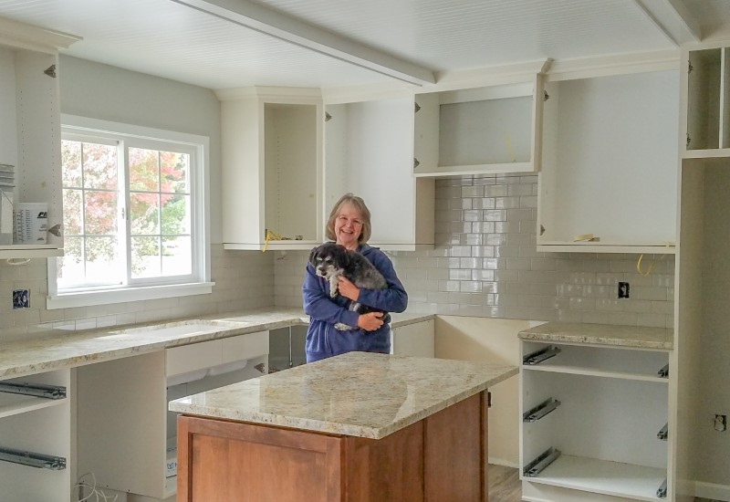 Homeowner and puppy during kitchen update, Golden Rule Remodeling & Design, Silverton Oregon